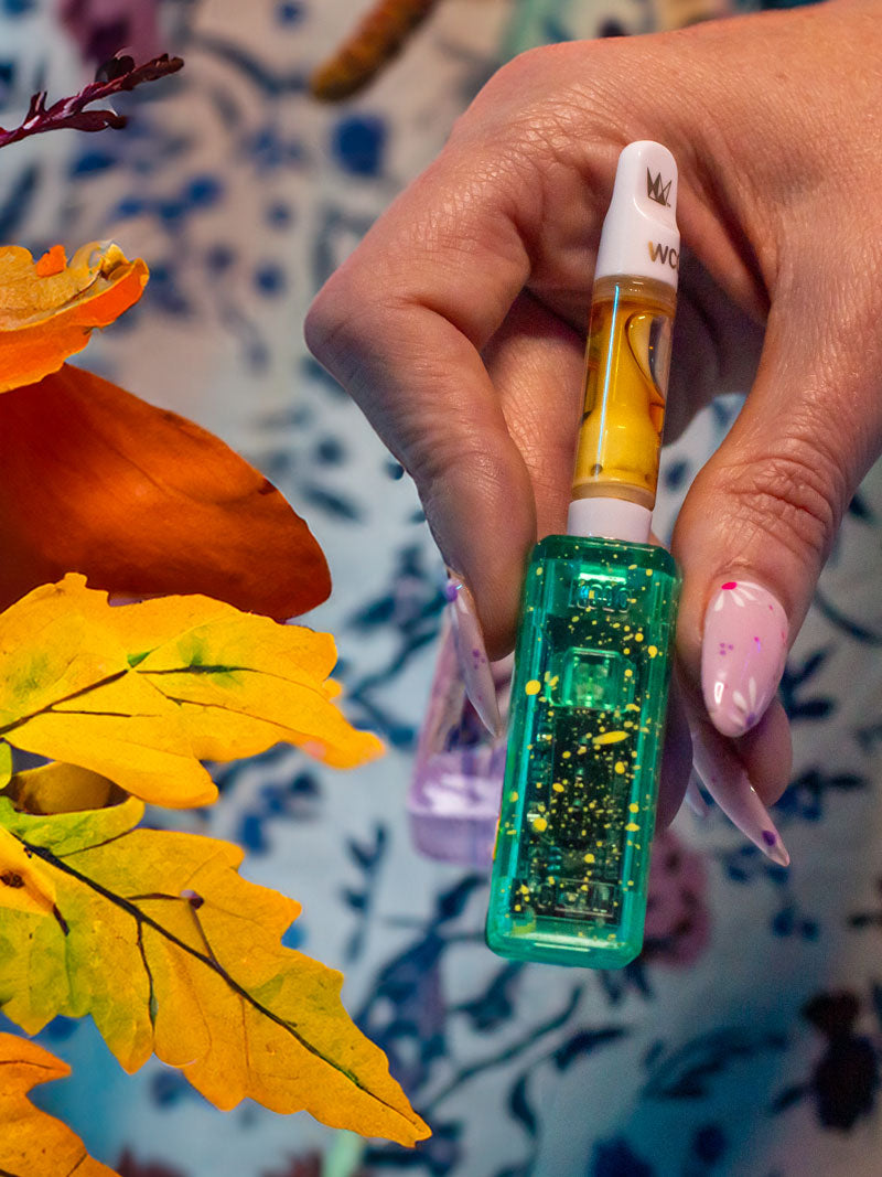 woman with pink nails holding the Wulf X-Ray Series Kodo with fall leaves